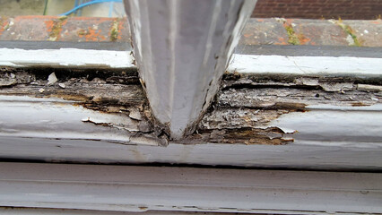 Close up of a damage to an old wooden framed window