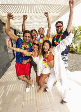 Group of friends enjoying a festive summer party outdoors