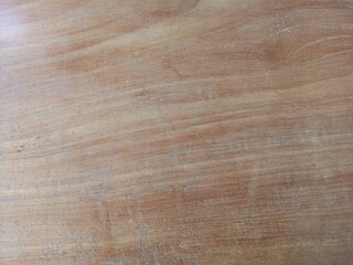 The surface of the wooden table is brown background