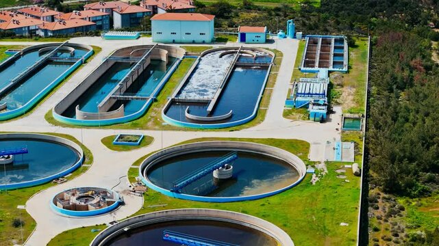 Drone shot of sewage treatment plant, clarifier tank type sludge recirculation in water treatment plant. Industrial wastewater treatment plant