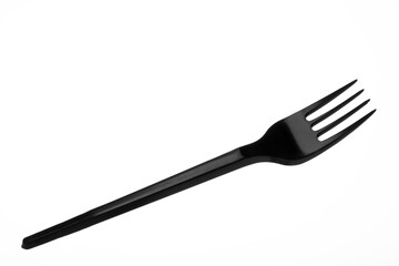 Disposable black plastic fork. Disposable cutlery. Plastic dishes.