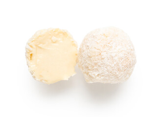 Delicious chocolate candies with coconut topping isolated on white background