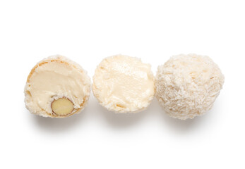 Delicious chocolate candies with coconut topping isolated on white background