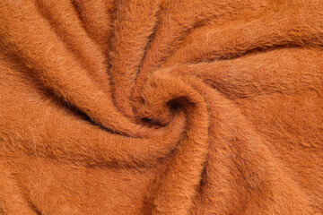 Texture of stylish knitted fabric with folds as background
