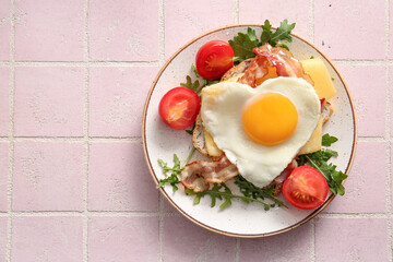 Plate with tasty fried egg, toast, bacon, tomatoes and arugula on light tile background