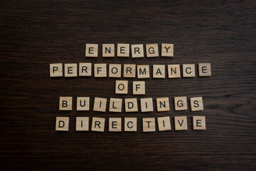 Energy Performance of Buildings Directive EPBD regulating the transition of energy performance in the EU, written with wooden block letters