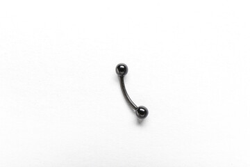 Belly button piercing ring on white background