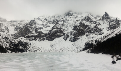 Impressive winter landscape of Morskie Oko or Eye of the Sea lake in Tatra Mountains, Poland