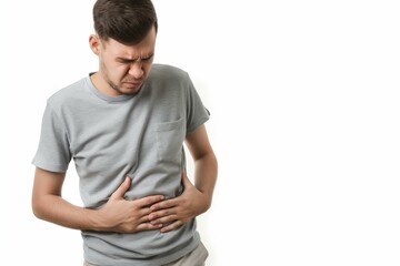 Fototapeta premium A man with pain in the stomach on the white background. Liver Disease Liver failure. World Hepatitis Day concept with copy space.