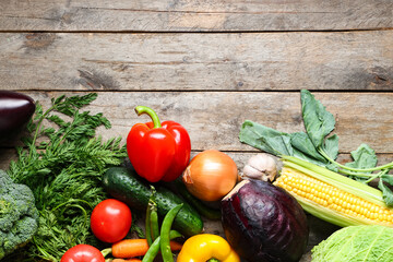 Different fresh vegetables on grey wooden background