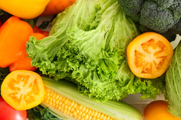 Different fresh vegetables on white wooden background, closeup