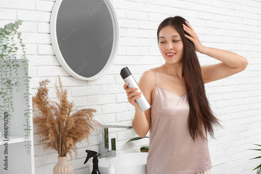 Sticker beautiful young happy woman applying hair spray at home