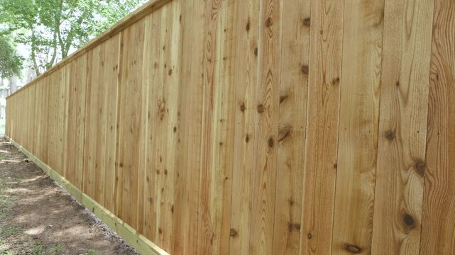 New cedar fence with wood preservative applied