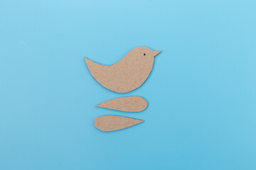 The main body of the bird is in brown cardboard color.