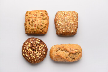 Different delicious buns on white background