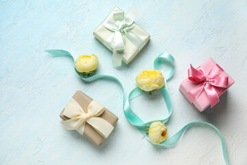 Composition with figure 8 made of ribbon, gift boxes and peony buds on blue background. International Women's Day celebration