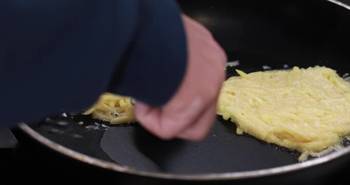 Pancakes are fried in oil in a frying pan. Video recipe. 