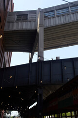 Outside Chelsea Market NYC. Brick wall building facade with bistro string lights. 