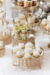 A table full of desserts and pastries, including a variety of cakes and cupcakes