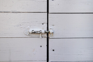 Close-up taken of wooden door with iron lock,background