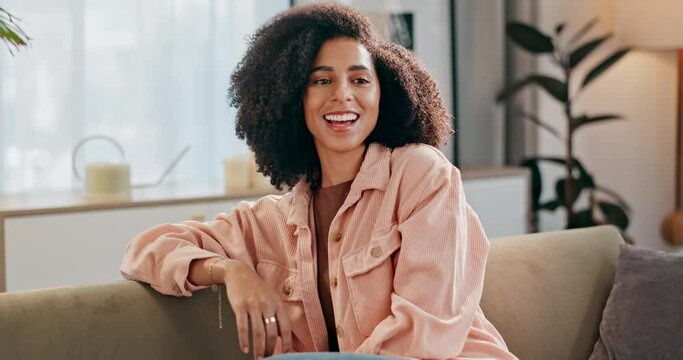 Happy, black woman and watching tv with popcorn on sofa for online streaming, movie or series at home. African or female person with smile and laughing for funny show or subscription in living room