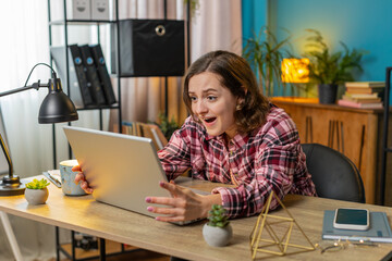 Displeased sad shocked woman using laptop notebook typing browsing working loses becoming surprised...