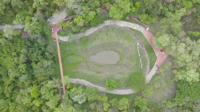 Aerial top view of Kradong Volcano with forest trees in Buriram, Thailand. Tourist attraction landmark. Nature landscape background