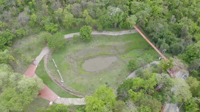 Aerial top view of Kradong Volcano with forest trees in Buriram, Thailand. Tourist attraction landmark. Nature landscape background
