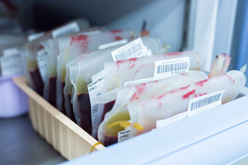 Close up red blood bag in storage blood refrigerator at blood bank unit laboratory.Save life and...