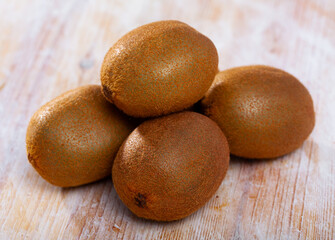Tasty kiwi on wooden surface
