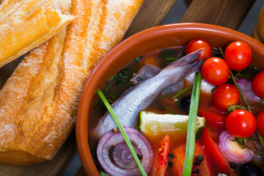 Fisherman's hoosh boiled with poutassou, small sea fish, tomatoes and onion
