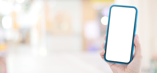 Woman hand holding black smart phone with blank screen for mock up background with copy space, template, technology and lifestyle