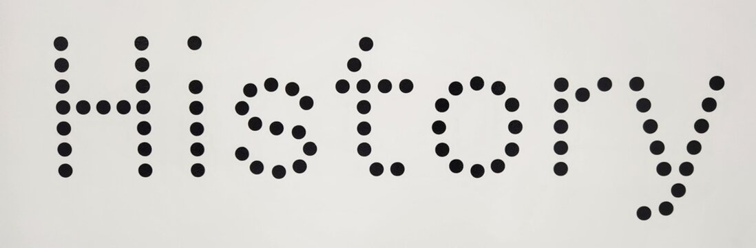 History in black and white background with dots