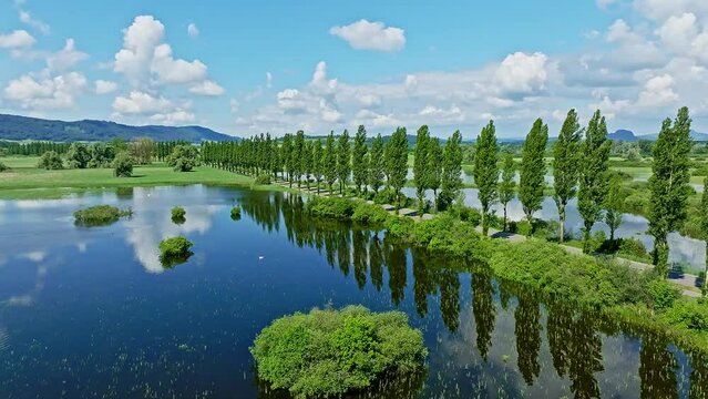 Aerial view of the Radolfzell Aachried at high tide with the Mooser Damm, which connects the town and the surrounding area of Radolfzell with the Hoeri peninsula. On the horizon to the left is the