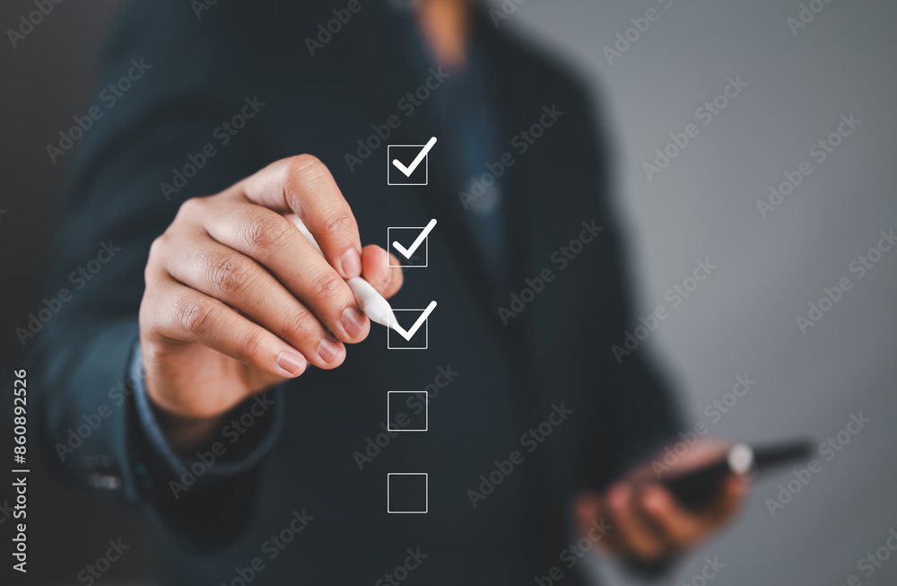 Poster Businessman use pen to tick correct sign mark in checkbox for quality document control checklist and business approve project concept.