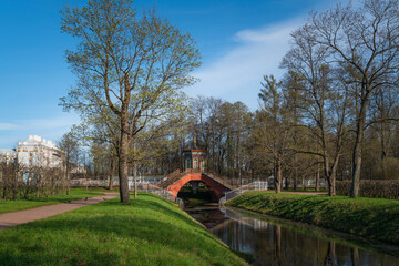 Cross bridge (Krestovy bridge) in the Alexander Park of Tsarskoye Selo on a sunny spring day,...