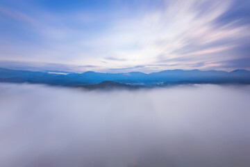 Sunrise at Bukit Tabur  / Tabur Hill, Kuala Lumpur, Malaysia. Mountain scenery., clouds, fog and mist. Long exposure setting.