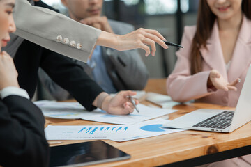 Group of business people meeting and present work on the board
