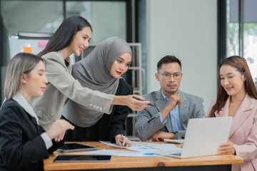 Group of business people meeting and present work on the board