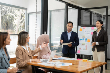 Asian Business Group Chat about graph work Present in meetings, in the office