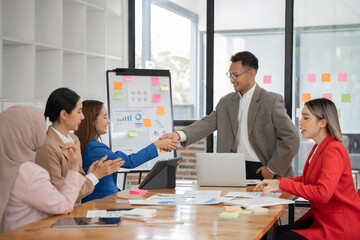 Asian Business Group Chat about graph work Present in meetings, in the office