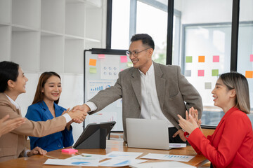 Asian Business Group Chat about graph work Present in meetings, in the office