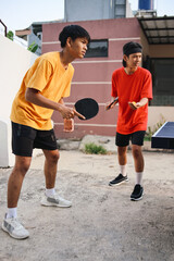 Full Length Of Young Asian Ping Pong Ready To Service The Ball. Ping Pong Team Match