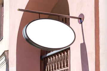 Blank Mockup Of Shop Signboard Hanging On The Pink Wall. Empty Ellipse-Shaped Restaurant Sign For The Logo