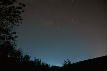 Night stars in the mountain sky.