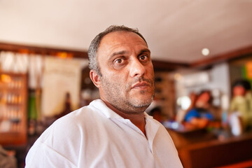 Obraz premium Egyptian adult male mid age wearing casual clothing in a room with a cozy atmosphere