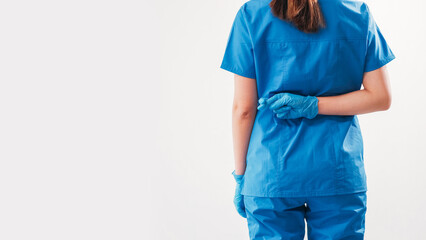 Hoping doctor. Crossed fingers. Unrecognizable female surgeon worrying showing hand gesture behind...