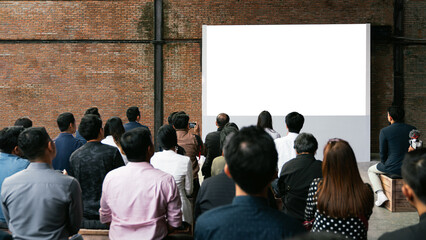 Obraz premium Front view of mockup blank white screen in vintage hall and audiences. Business and Entrepreneurship concept.