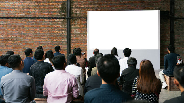 Front view of mockup blank white screen in vintage hall and audiences. Business and Entrepreneurship concept.