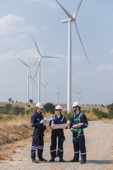 Team engineer wind turbine worker safety uniform survey discuss operational planning windmill field clean energy. Alternative technology protect environment reduce global warming problems.